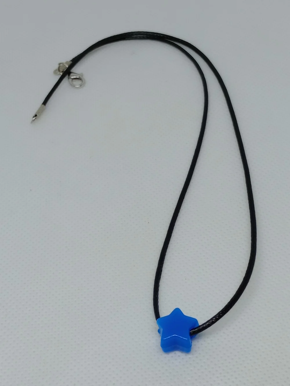 Blue Star Pendant Necklace on Black Cord